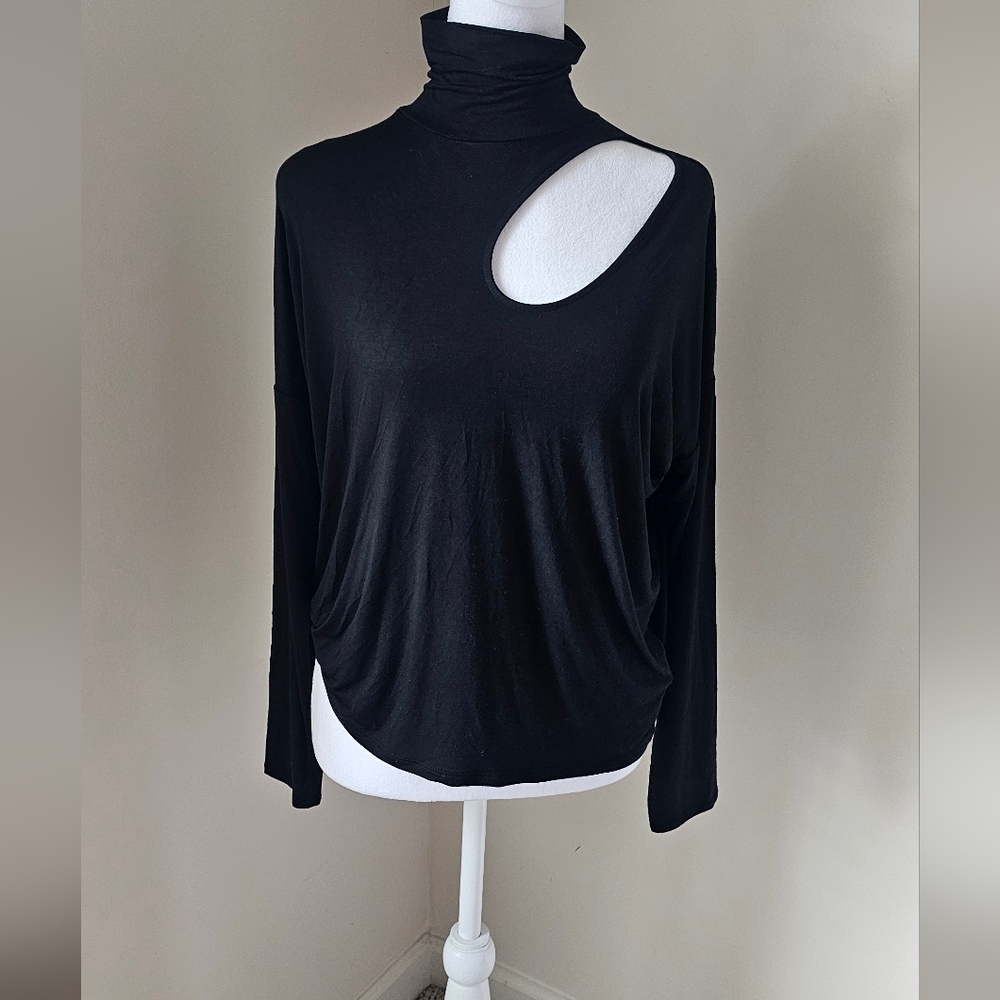 Women's black turtle neck cut out on the front of blouse. Women's black turtle n